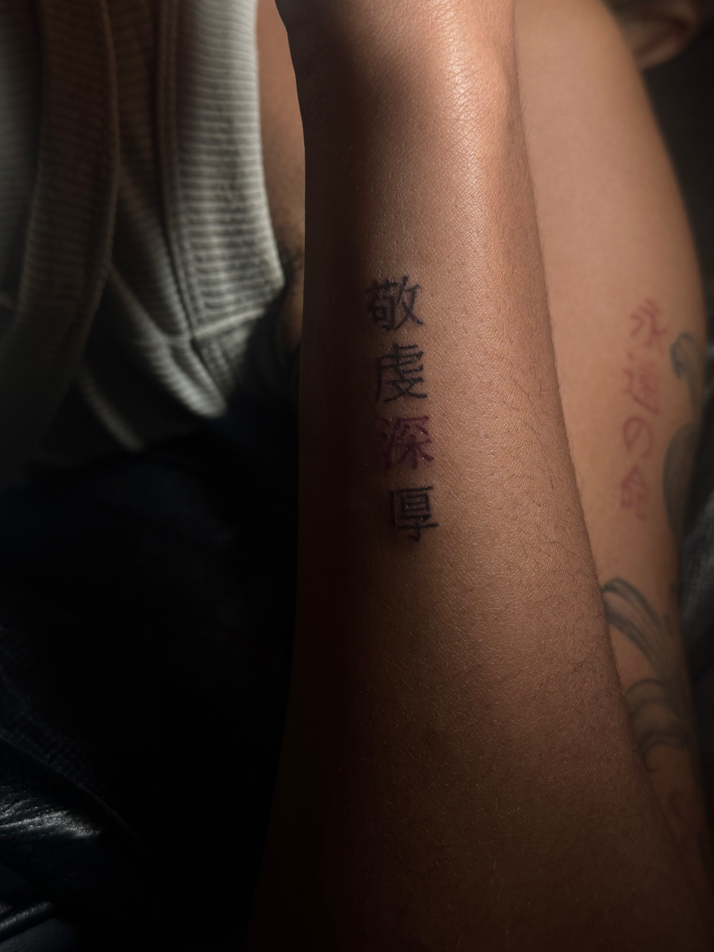 Kanji lettering forearm tattoo
